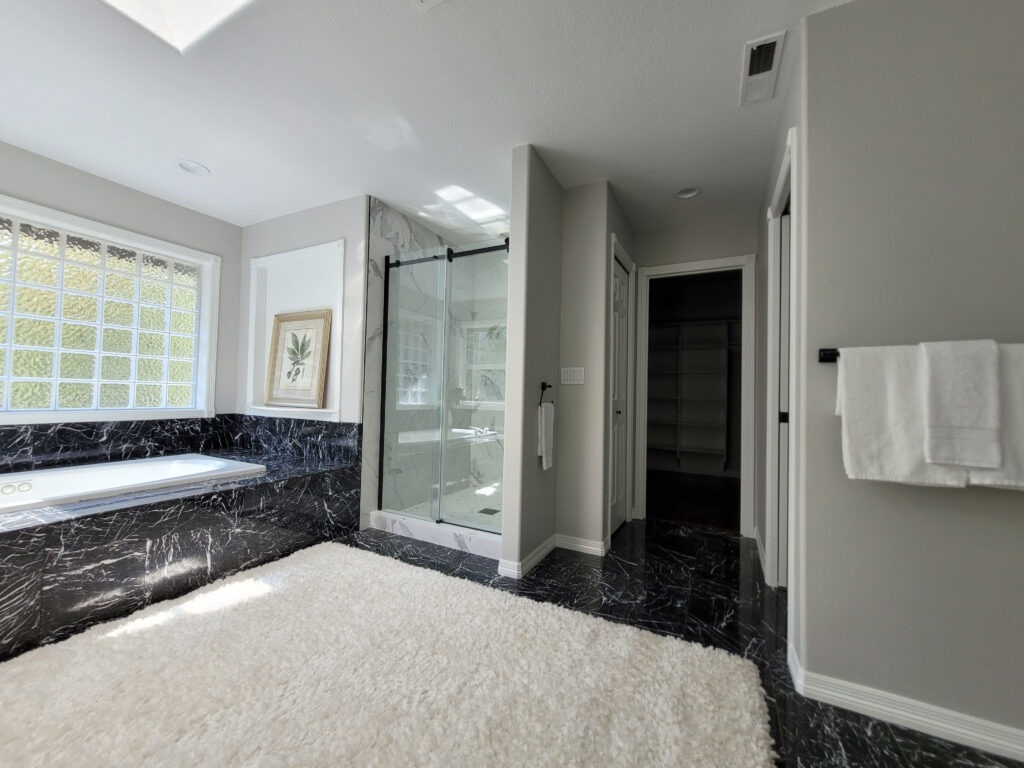 Master bathroom with newly painted walls and white trim