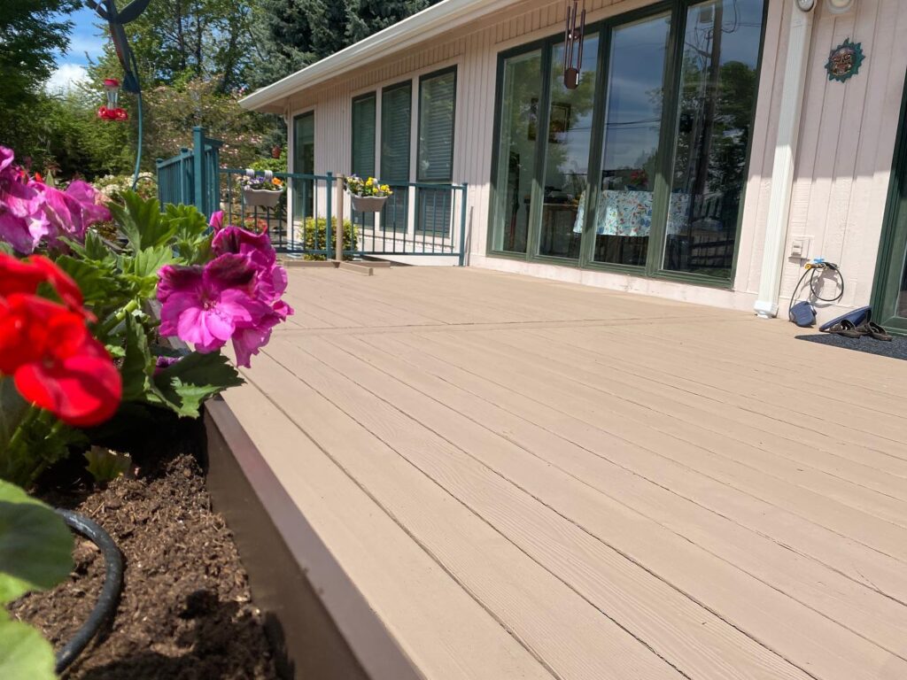 Refinished back deck with flower planters